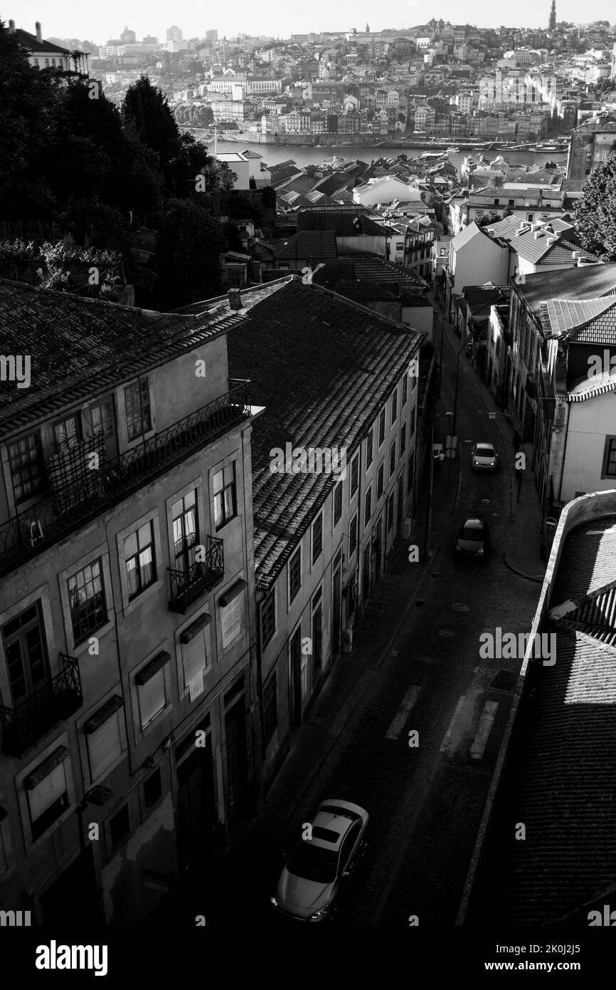 View one of the streets in Vila Nova de Gaia, and panorama of the Porto, Portugal. Black and white photo. Stock Photo