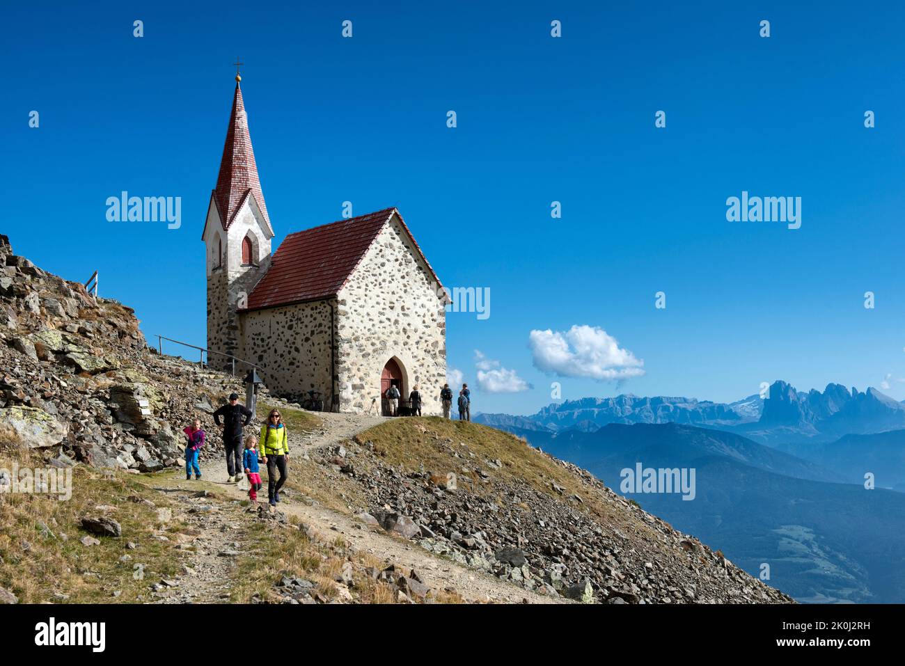 Tourists near the Sanctuary of Santa Croce di Lazfons and panoramic Sella  group, Valle di Isarco valley, Trentino Alto Adige, Italy, Europe Stock  Photo - Alamy
