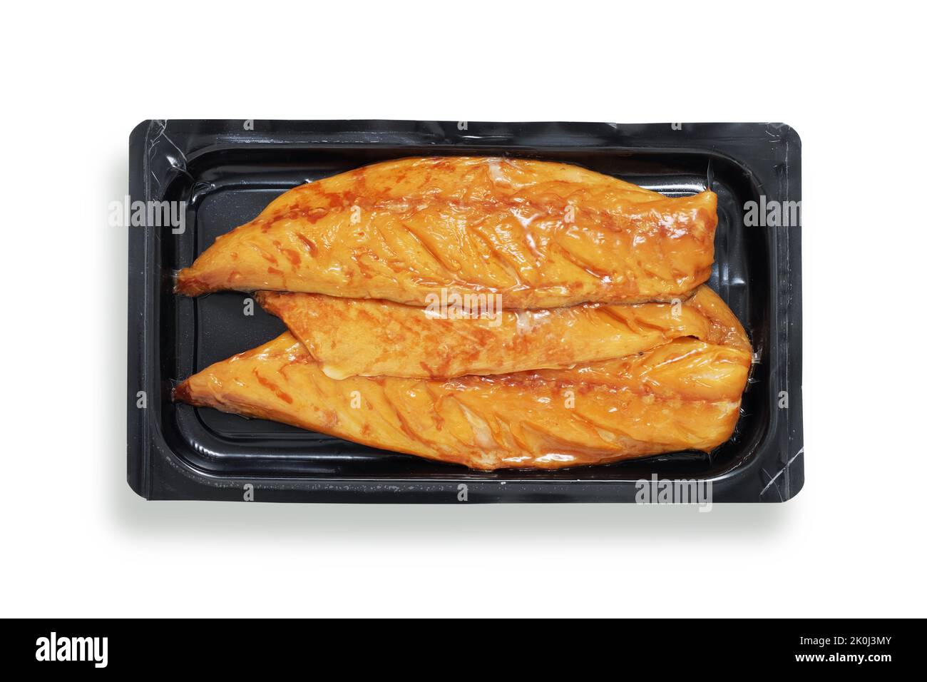 Smoked mackerel fillets in black retail tray, shot from above, isolated on white with path cut out Stock Photo