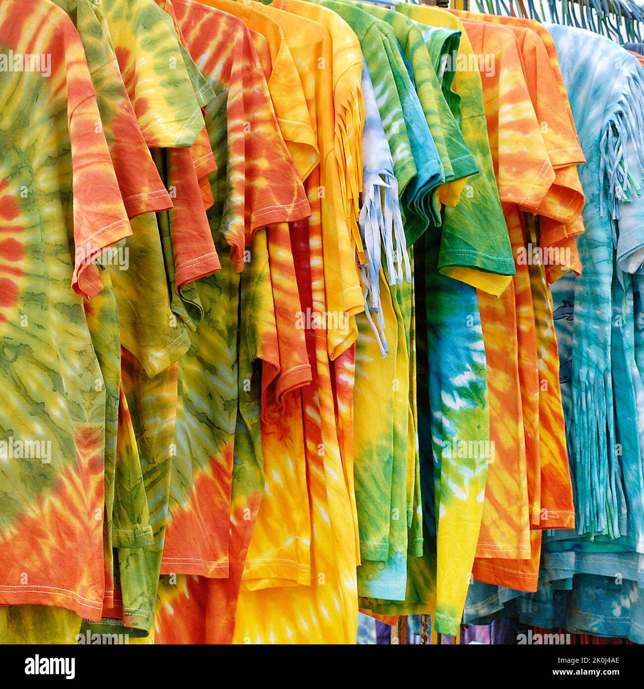 Close up of tie dye t-shirts for sale on a market stall Es Cana Ibiza Spain Stock Photo