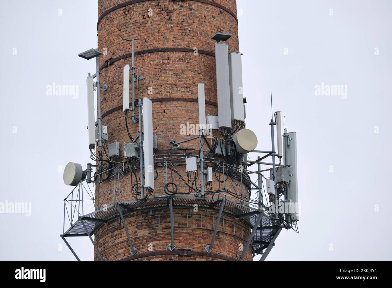 Closeup and detailed view of various GPS, cellphone, 3G, 4G and 5G equipped telecommunication tower Stock Photo