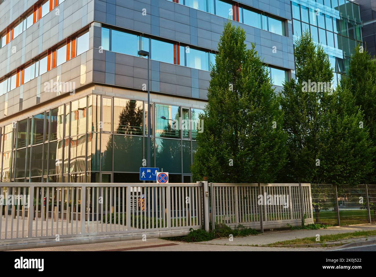 Facade of buiding with green trees, Modern office building in city for