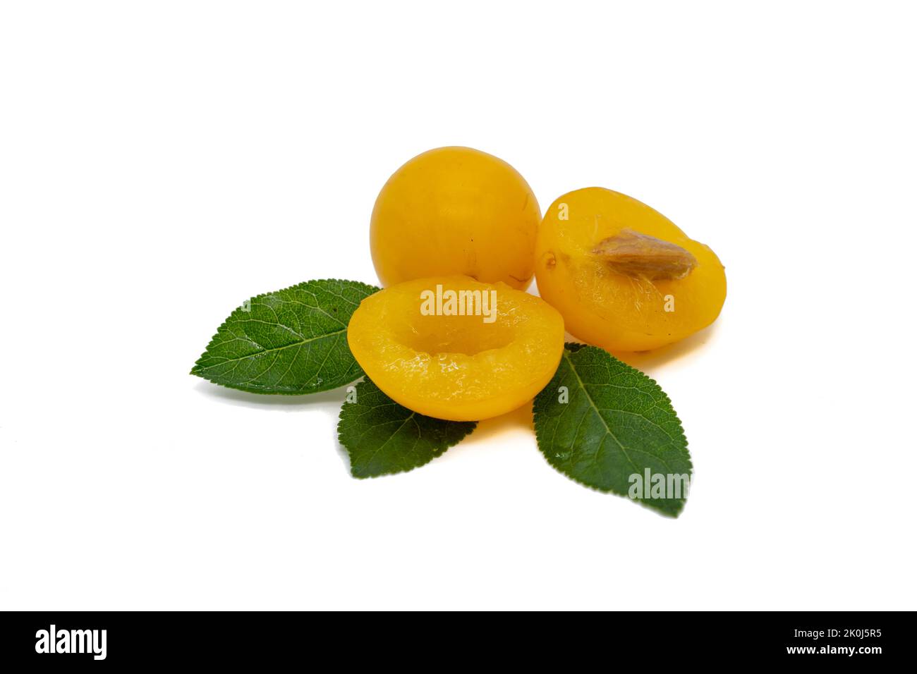 Spilling plum isolated on white background Stock Photo