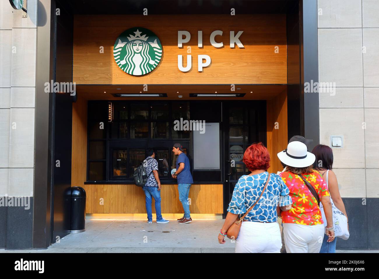 Starbucks Pick Up, 485 5th Ave, New York, NYC storefront photo of a seatless coffee shop location optimized for digital orders on the go. Stock Photo