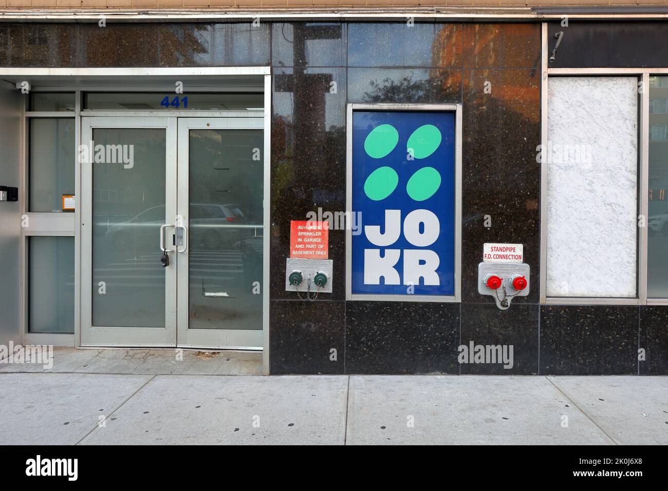 A closed, out of business, Jokr rapid online ordering warehouse 'dark store' Manhattan, New York. Jokr has ceased business in the US. Stock Photo