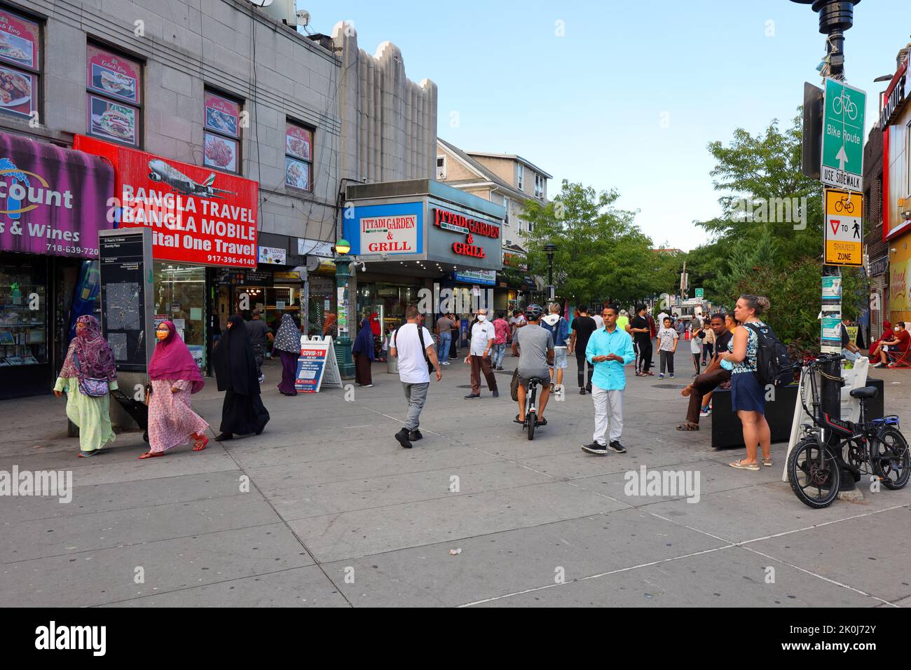 People, shoppers at Diversity Plaza, a pedestrian plaza located at 37th Rd between 73rd and 74th Sts, Jackson Heights, Queens, New York, Aug 30, 2022 Stock Photo