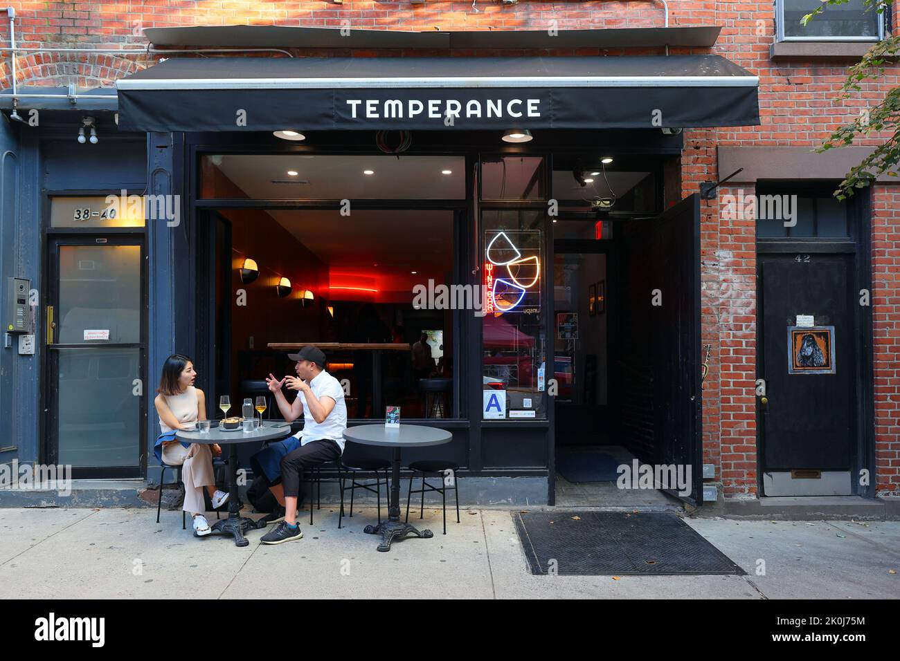 Temperance Wine Bar, 40 Carmine St, New York, NYC storefront photo of a wine bar in Manhattan's Greenwich Village neighborhood. Stock Photo