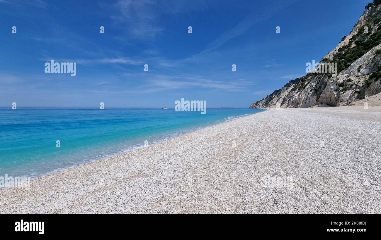 fA white sandy beach with a blue sea in Nidri, Lefkada island, Greece Stock Photo