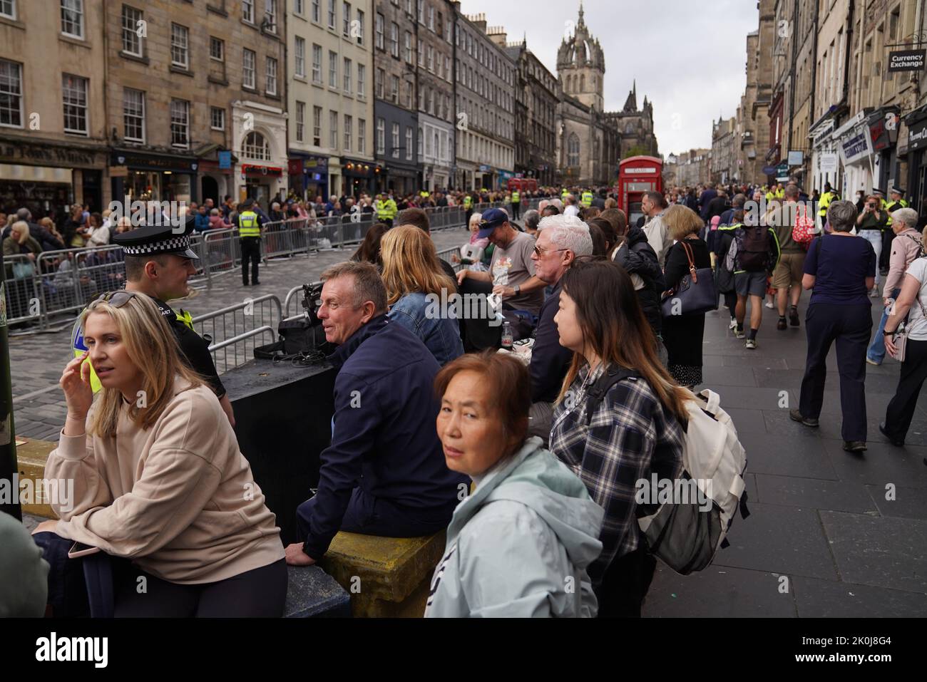 People gather on the Royal Mile in Edinburgh ahead of the procession of