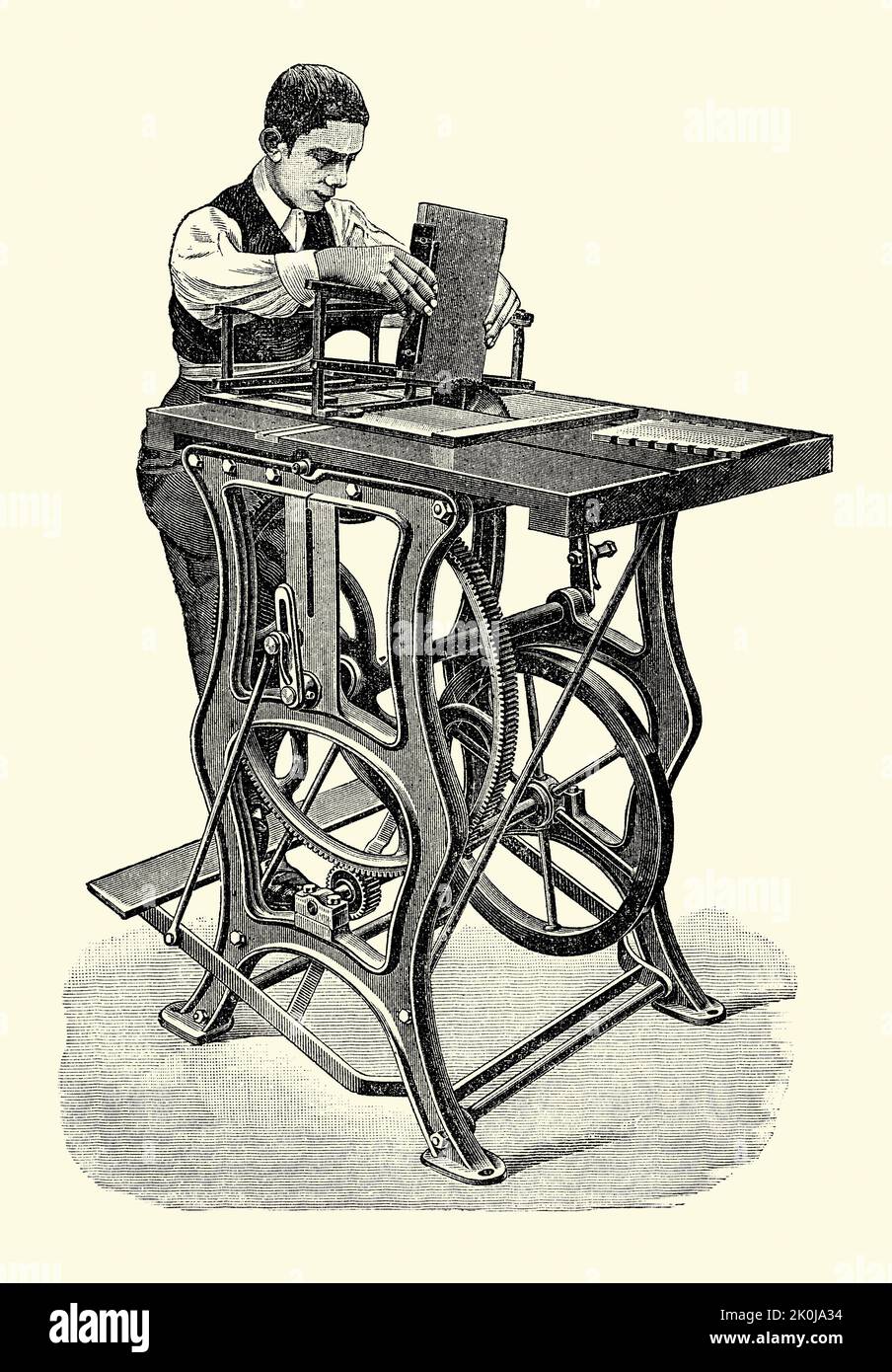 An old Victorian engraving of a table saw with a Britannia dove-tailing device. It is from a book of 1890. In 1890 the first ever dovetailing machine was patented by the Britannia Company, Colchester, Essex, England, UK in 1890. The dovetailing jig or frame is used to make shallow, angled cuts in conjunction with a foot-powered saw – here it is being pedalled by the woodworker. A dovetail joint (or simply dovetail) is a joinery technique most commonly used in woodworking joinery/carpentry, mainly in furniture. Stock Photo