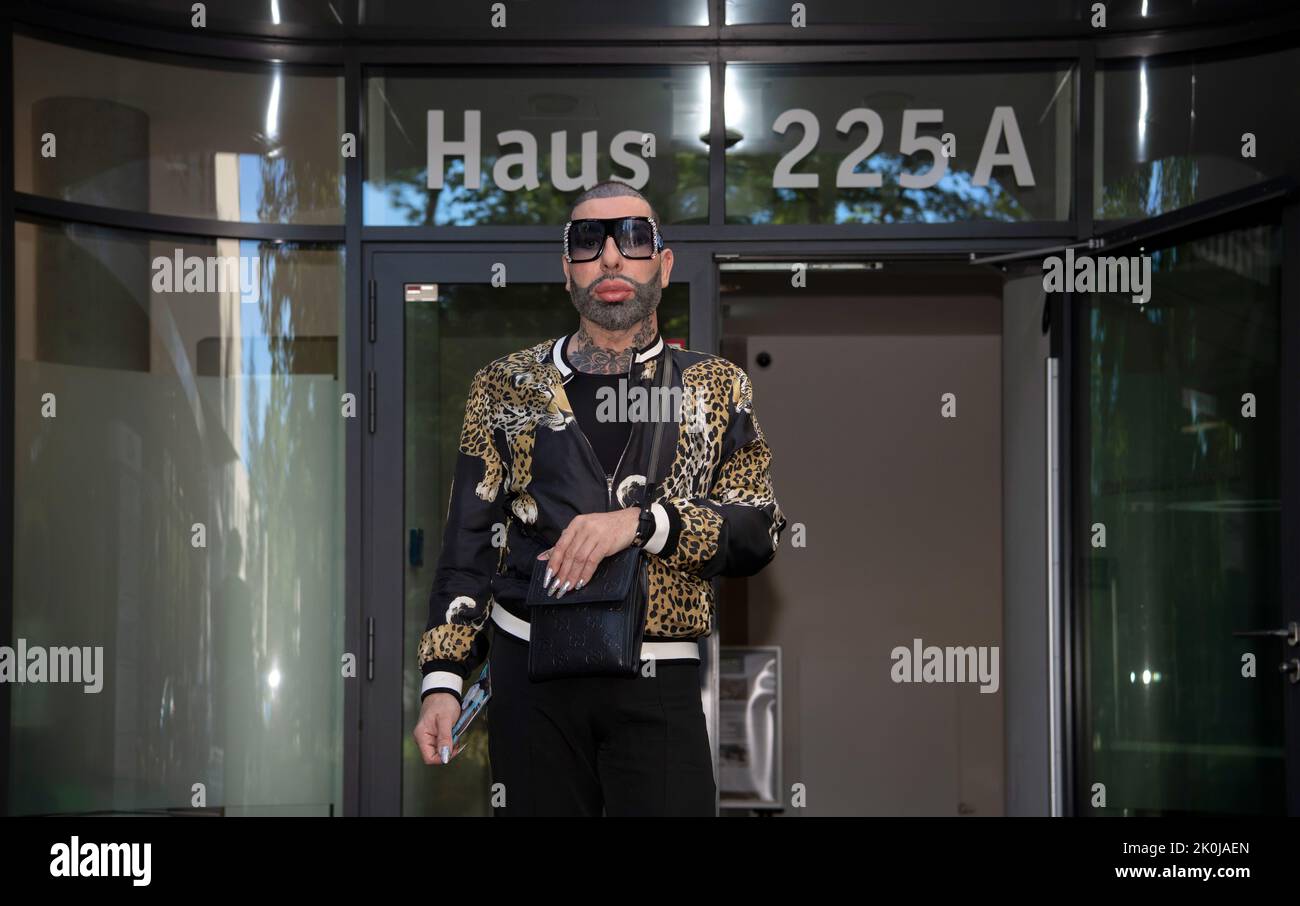 Berlin, Germany. 12th Sep, 2022. Fashion designer Harald Glööckler is standing in front of a medical center on Clayallee. He is being treated there for a slipped disc. Due to the illness, Glööckler has canceled all appointments for the time being. (to dpa: "Fashion designer Glööckler: "I've never had such pain before") Credit: Paul Zinken/dpa/Alamy Live News Stock Photo