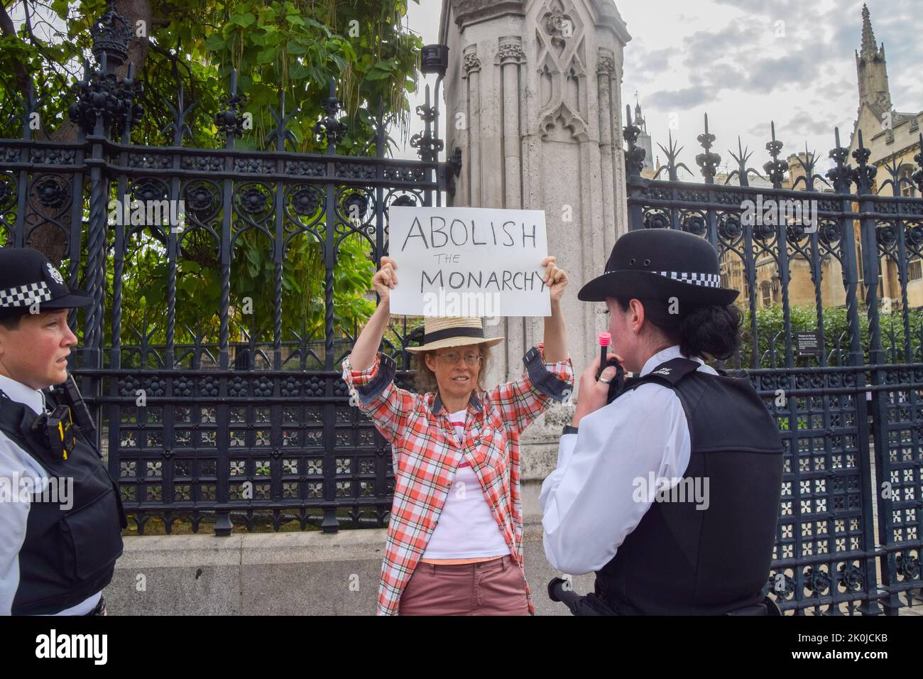 London, UK. 12th Sep, 2022. Police move an anti-monarchy protester outside Parliament ahead of King Charles' arrival. King Charles III visited Parliament today to receive the Motion of Condolence. Credit: Vuk Valcic/Alamy Live News Stock Photo