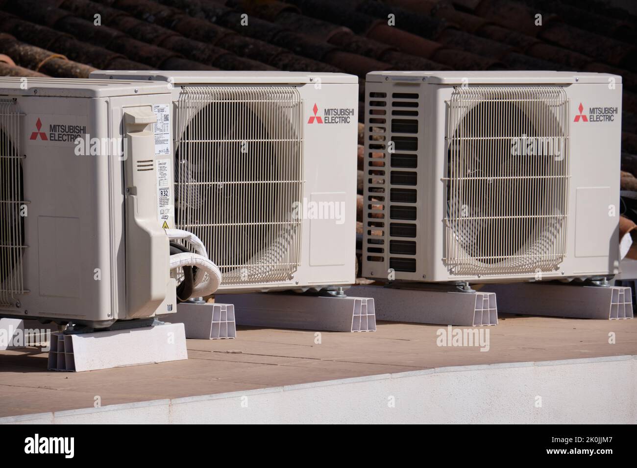 Mitsubishi Electric air conditioning units on the roof of a house