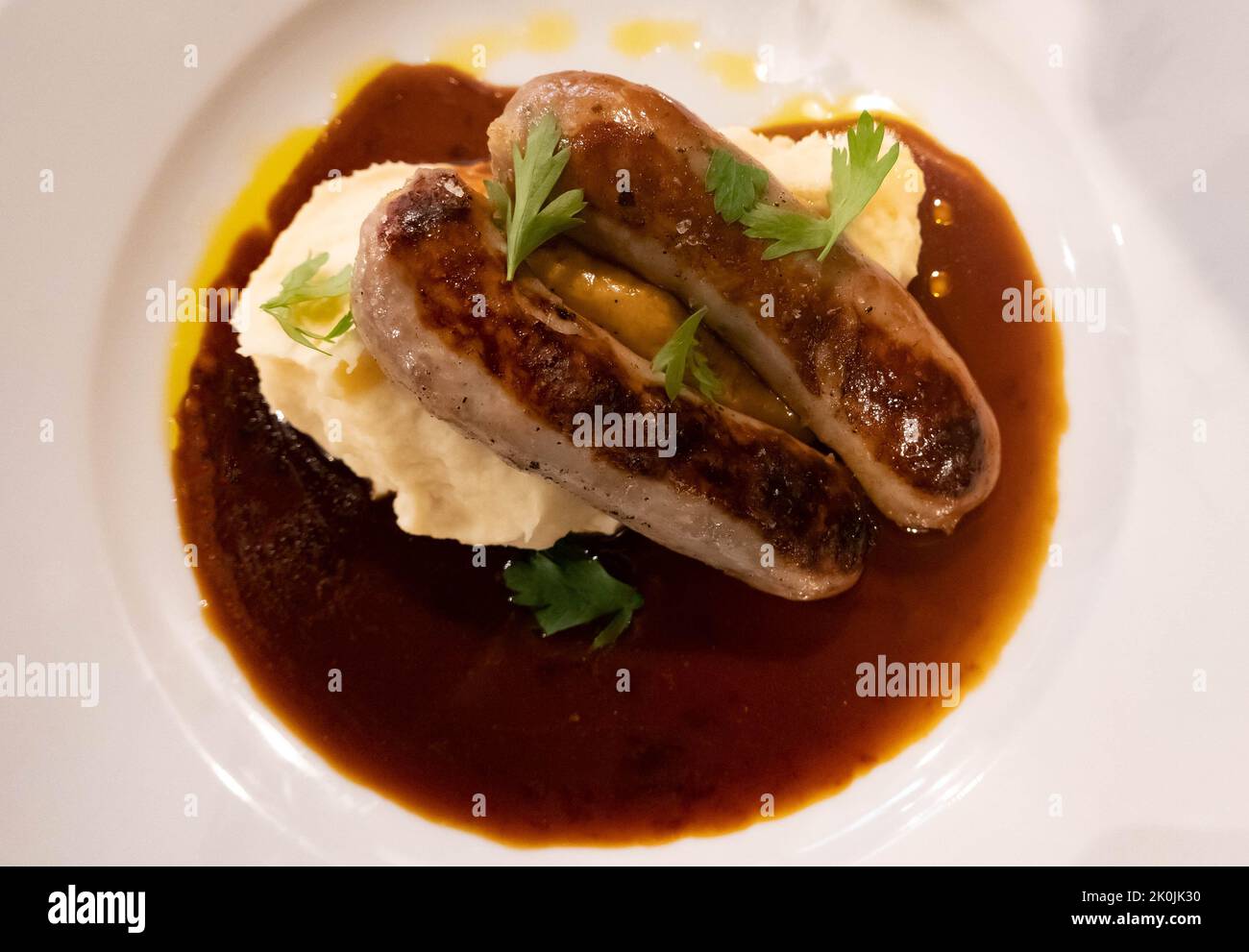 Cumberland sausage with mashed potatoes and gravy Stock Photo