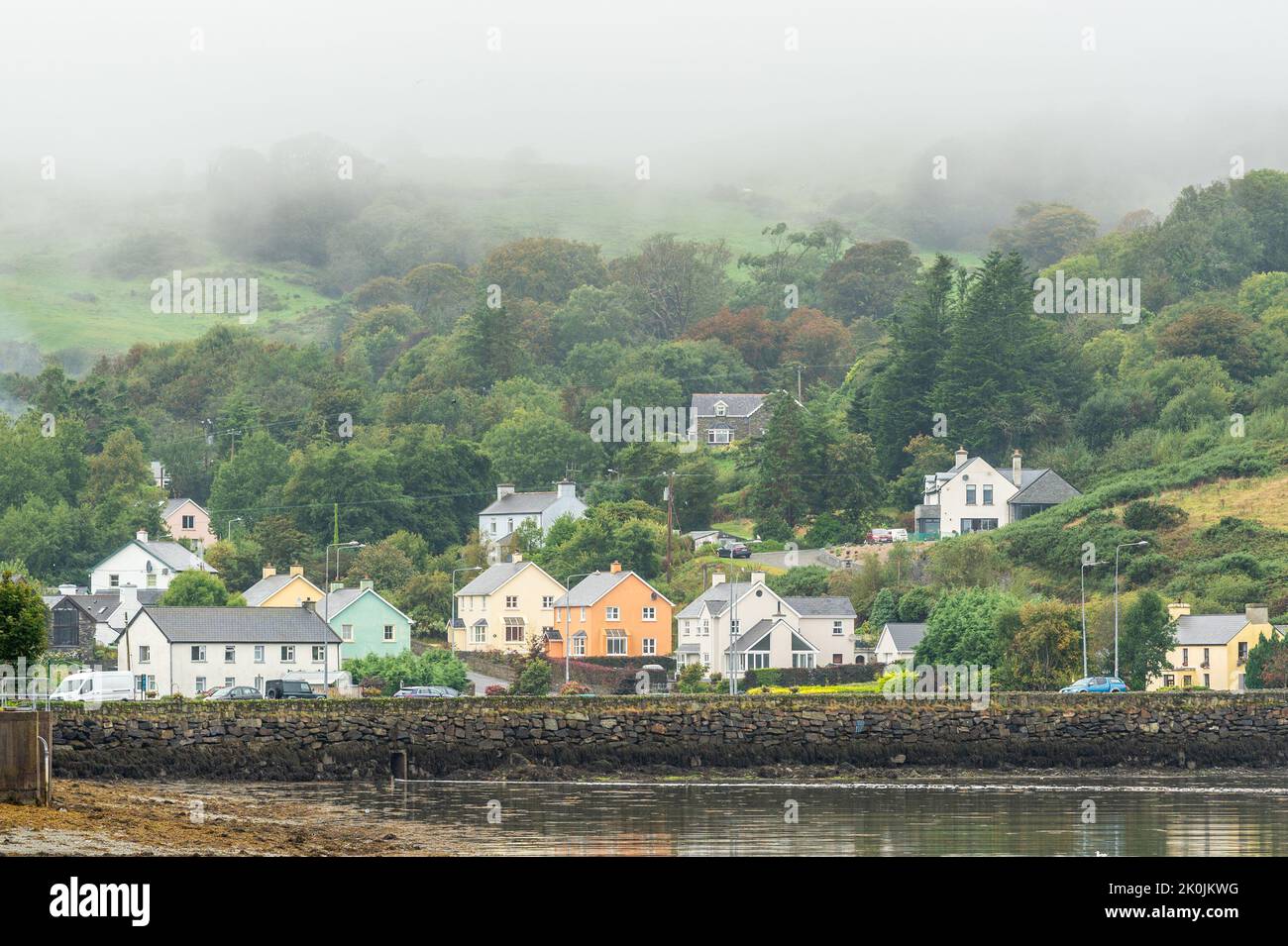 Union Hall, West Cork, Ireland. 12th Sep, 2022. Mist almost envelops houses in Union Hall on a dull and wet day in West Cork. Met Éireann has forecast brighter weather over the next few days. Credit: AG News/Alamy Live News Stock Photo