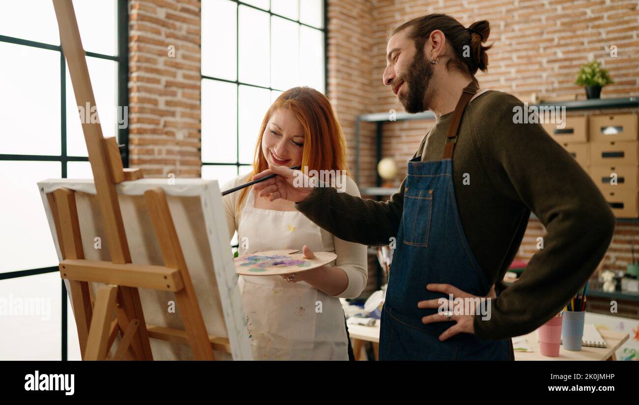 Man and woman couple smiling confident drawing at art studio Stock ...