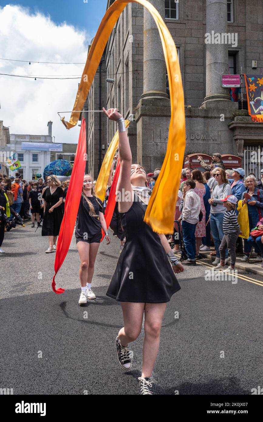 School students ribbon dancing in the Mazey Day parade celebrations as part of the Golowan Festival in Penzance in Cornwall in the UK. Stock Photo