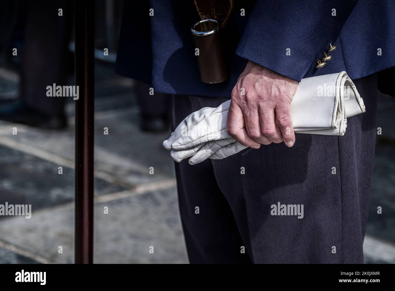 A mature veteran holding white leather gauntlets at the Military Day at Trebah Garden in Cornwall in the UK. Stock Photo