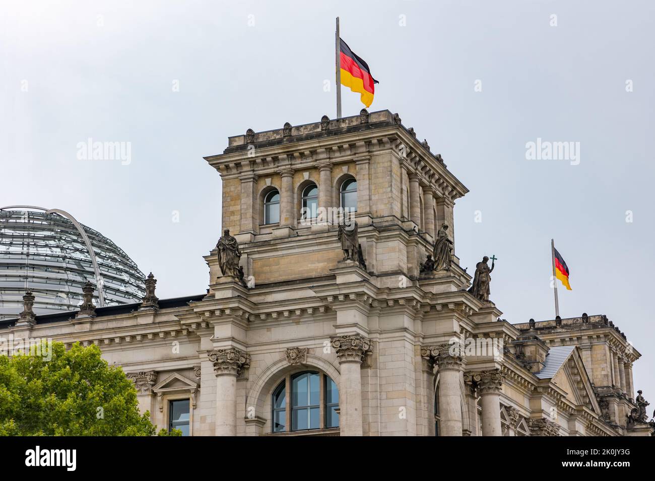 Tower from Reichstag with German flag in German capital Berlin, Germany Stock Photo