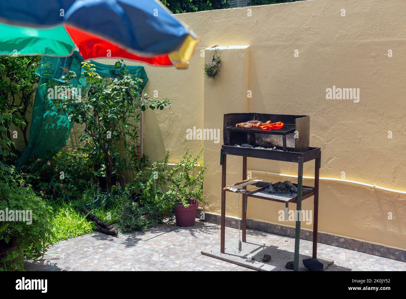 view of a small home barbecue in the backyard Stock Photo - Alamy