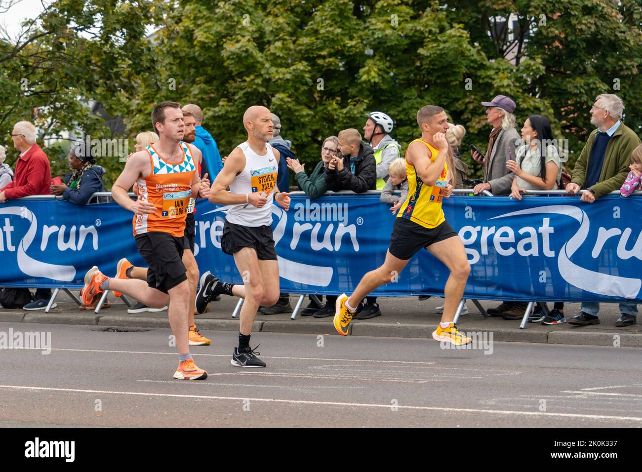 Competitors, Great North Run 2022 half marathon, in Gateshead, just after crossing over the Tyne Bridge from Newcastle upon Tyne, UK Stock Photo