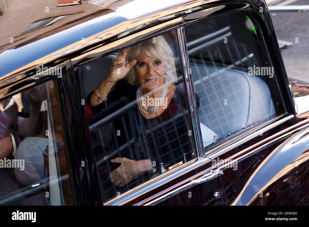 King Charles III (unseen) and the Queen are driven along the Royal Mile