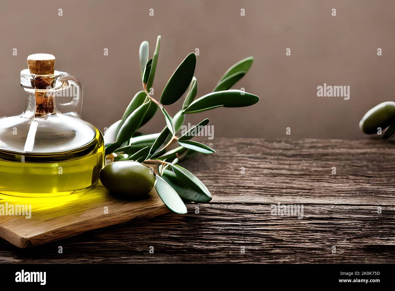 An olive branch and a green olive near a jar of olive oil on a wooden ...