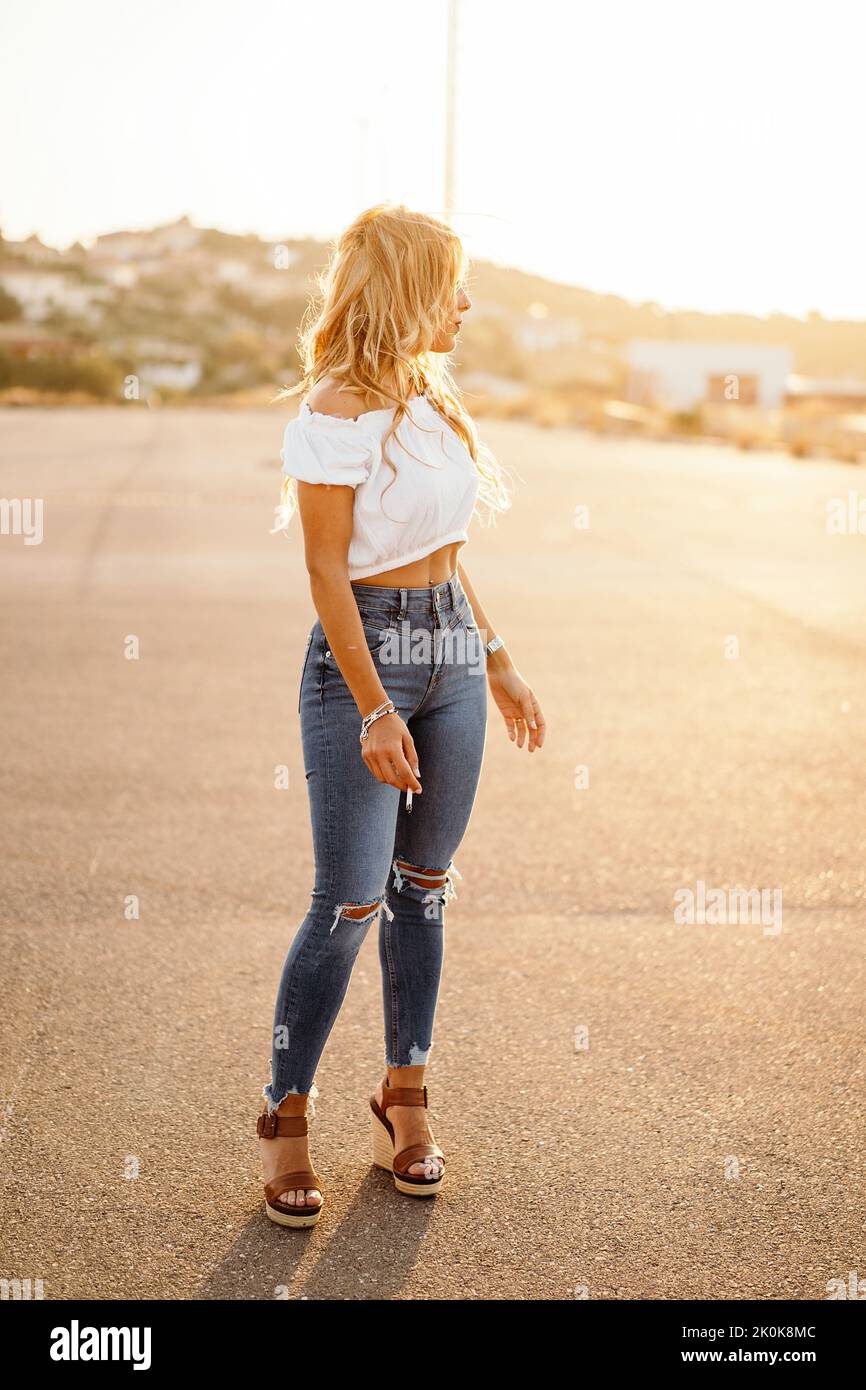 Tobacco woman jeans hi-res stock photography and images - Alamy