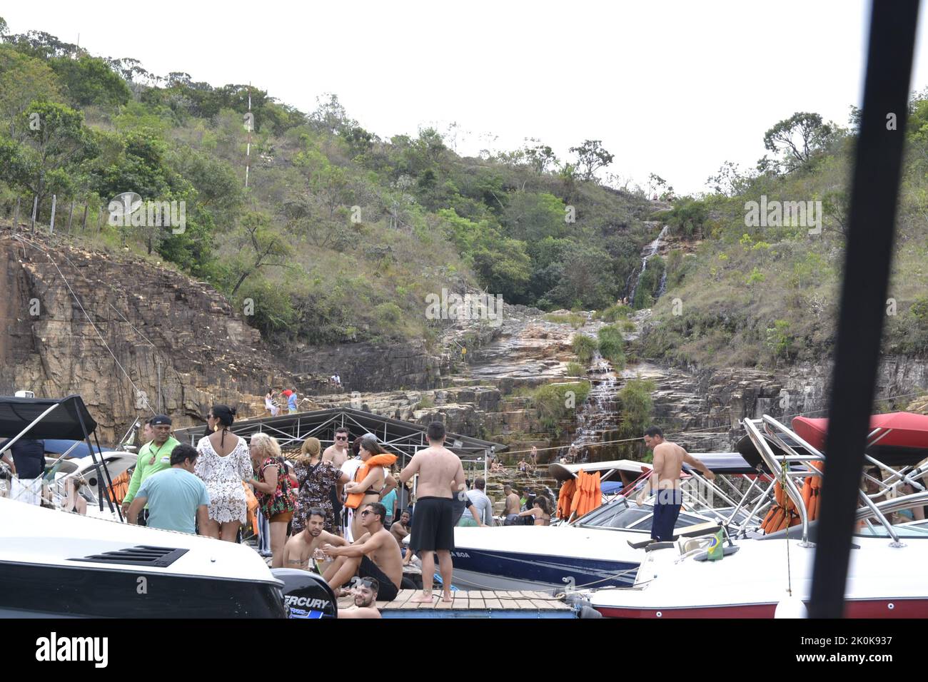 Tourists having fun on a speedboat ride, with several boats anchored, Brazil, South America, panoramic photo Stock Photo