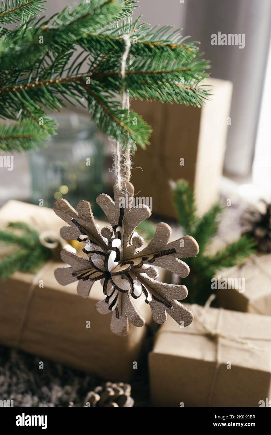 snowflake ornament hanging from a christmas tree Stock Photo - Alamy