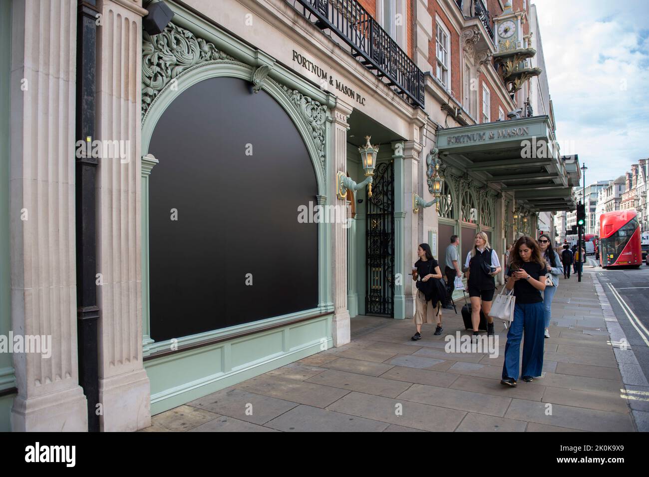 UK. 12th Sep, 2022. Fortnum and Mason's on Piccadilly pay tribute by blacking out their window