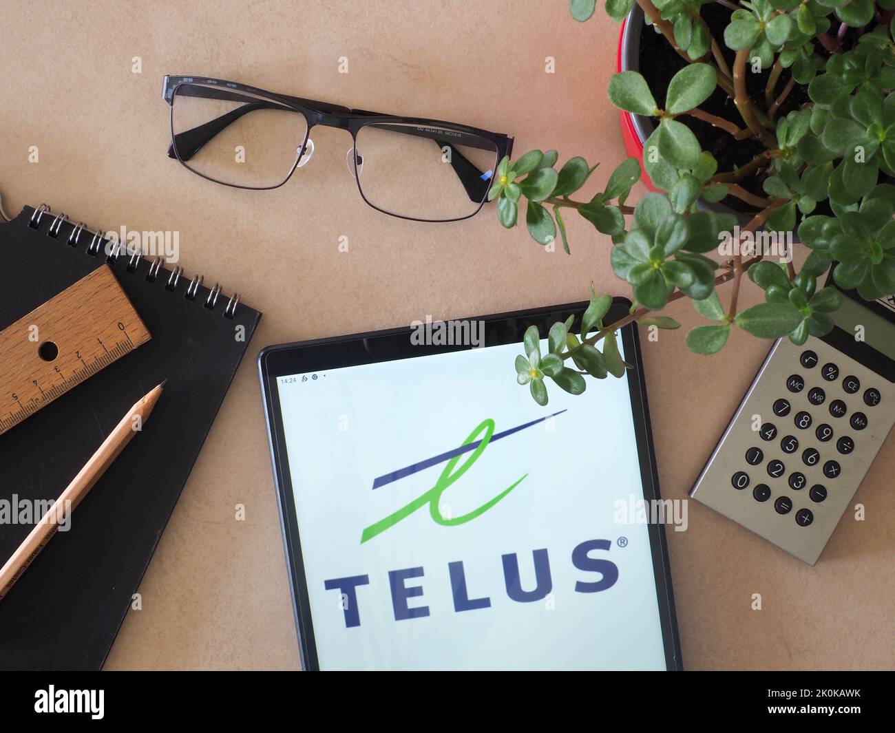 In this photo illustration, Telus International logo seen displayed on a tablet Stock Photo