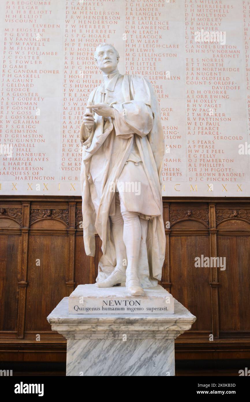 A white marble statue of Sir Isaac Newton, in the Trinity college ...