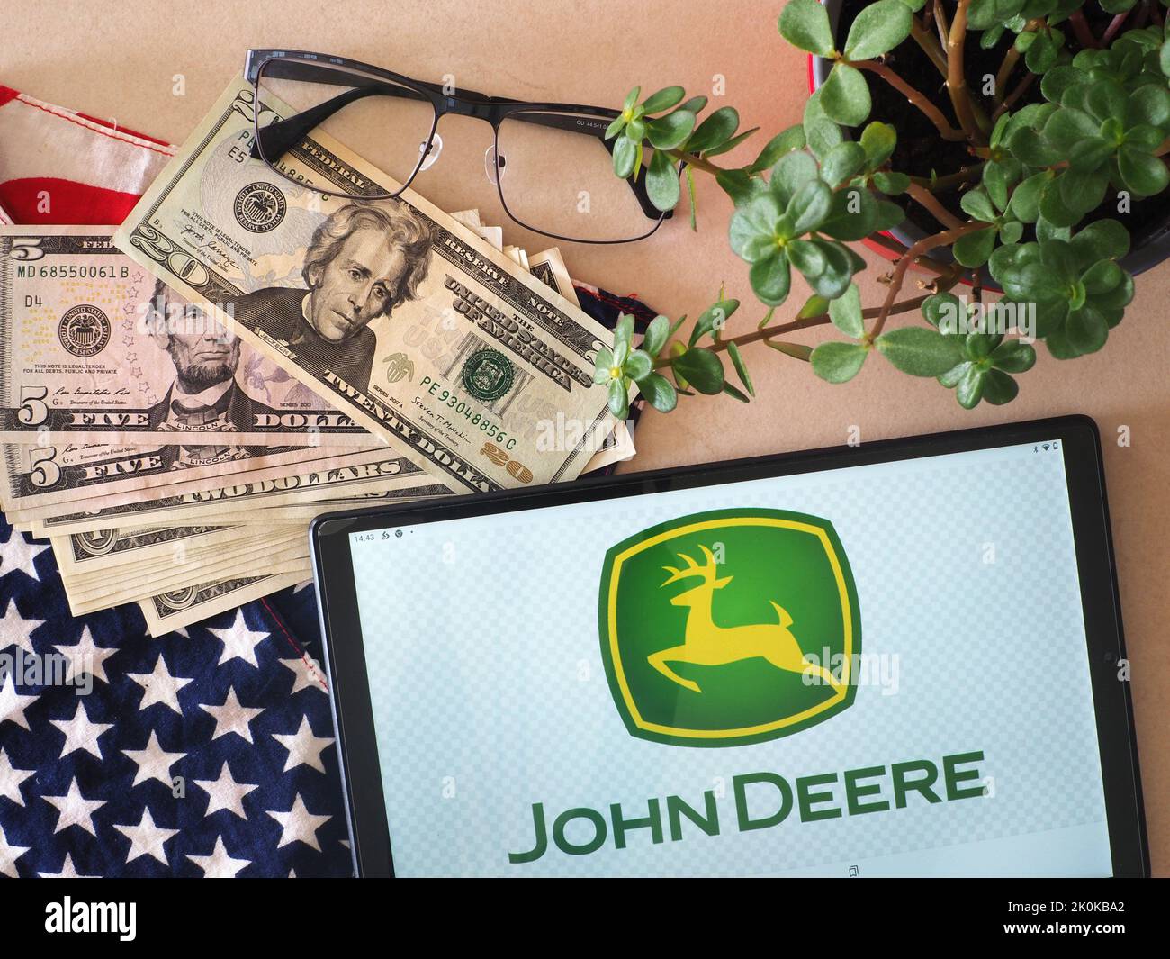 In this photo illustration, Deere & Company logo seen displayed on a tablet Stock Photo