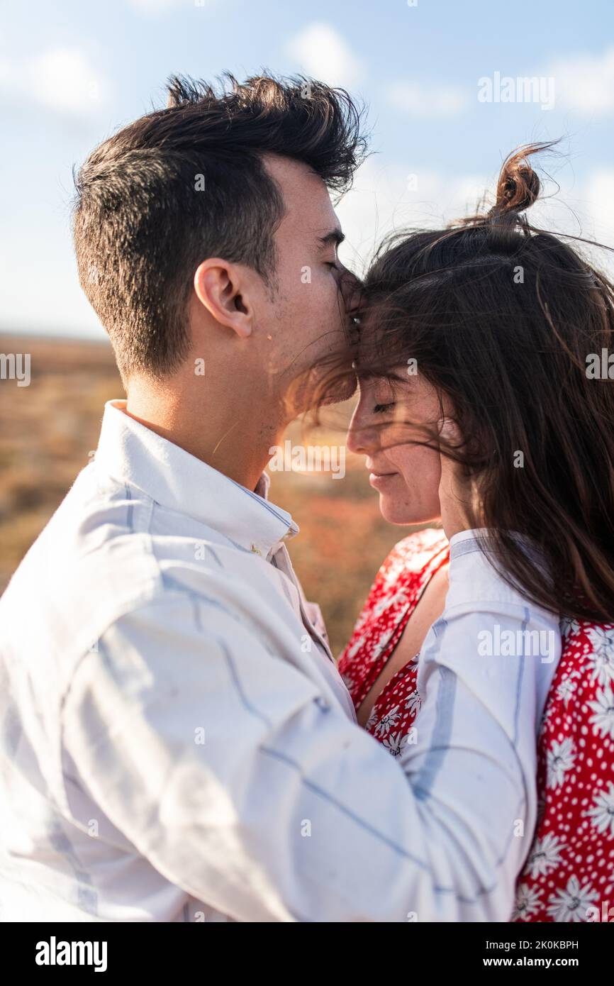 Couple hug forehead touch hi-res stock photography and images - Alamy