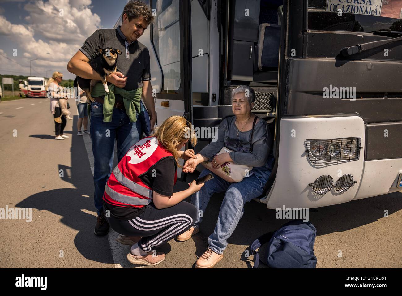 One refugee has to be treated for circulatory collapse during border clearance. Two buses left Mykolaiv in Ukraine to evacuate 110 refugees from the combat zone in Mykolaiv and the surrounding area. The refugees bid a tearful farewell to their relatives, who remained behind, before beginning their journey to Chisinau in Moldova. Stock Photo