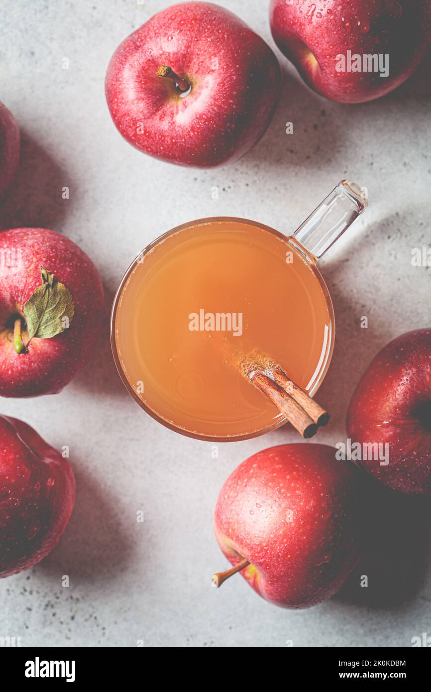 Homemade hot apple cider in a glass cup, top view. Autumn or winter warming drink. Stock Photo