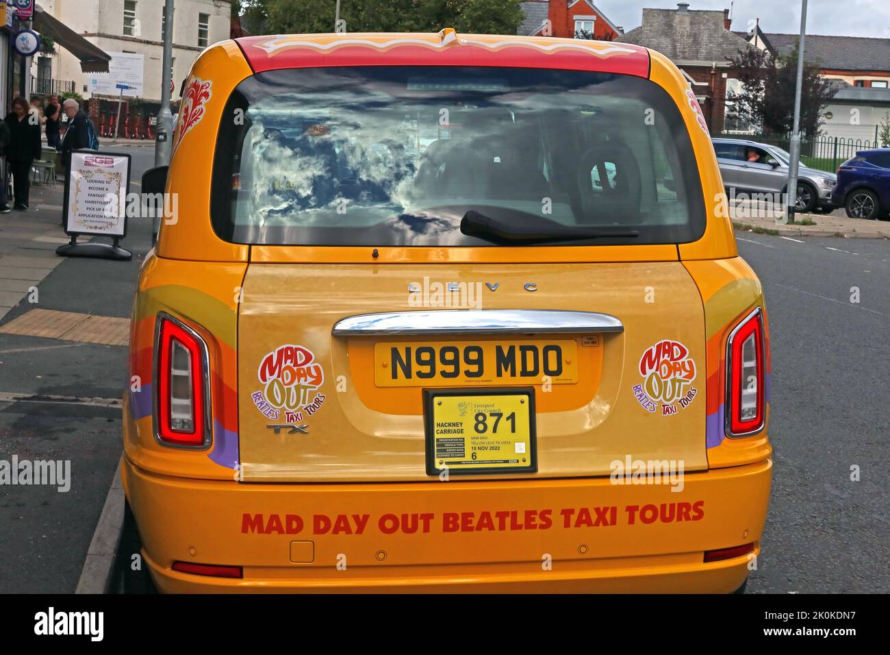 Yellow, Mad Day out, Beatles taxi Tours, cab, tourist trip, at Penny Lane, Liverpool, Merseyside, England, UK, L18 Stock Photo