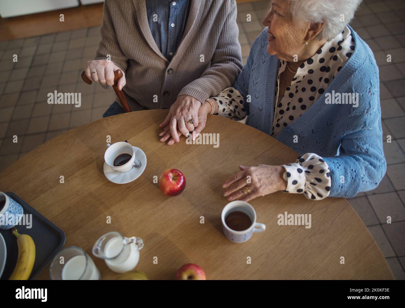 Top view of elderly couple enjoying breakfast in nursing home care center. Stock Photo
