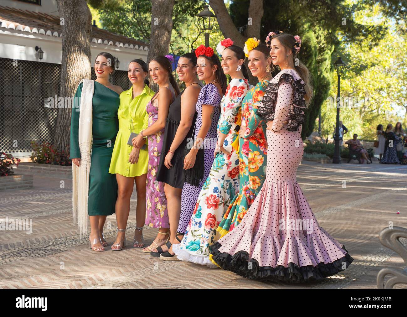 Women dressed in traditional flamenco dress during Feria, of Mijas, Andalucia, Spain. Stock Photo