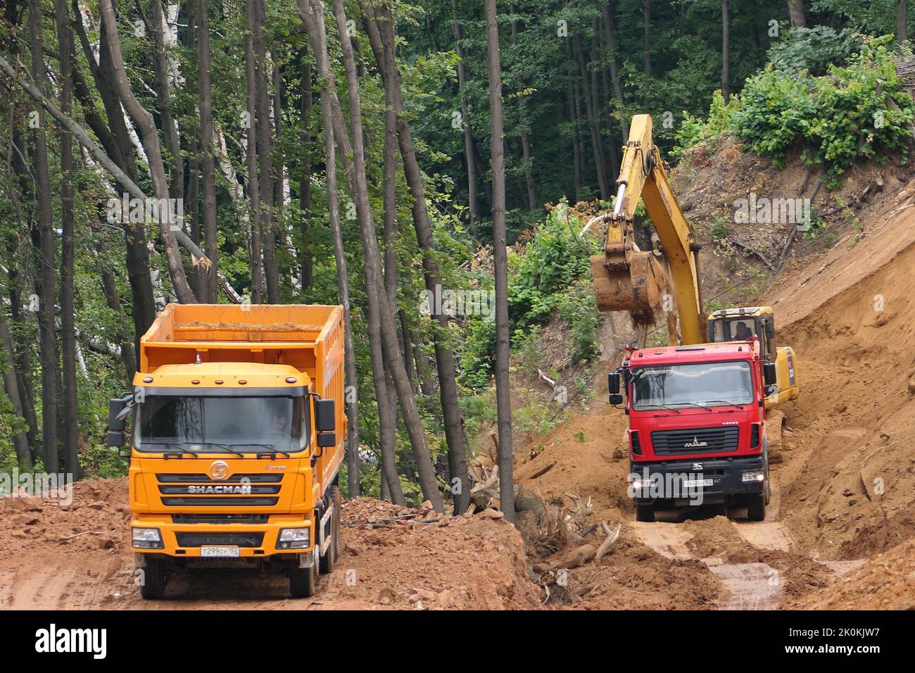 Nizhny Novgorod, Russia, natural monument Raspberry Ridge 09.10.2022. Road construction, construction site, Trucks take out the soil from Stock Photo