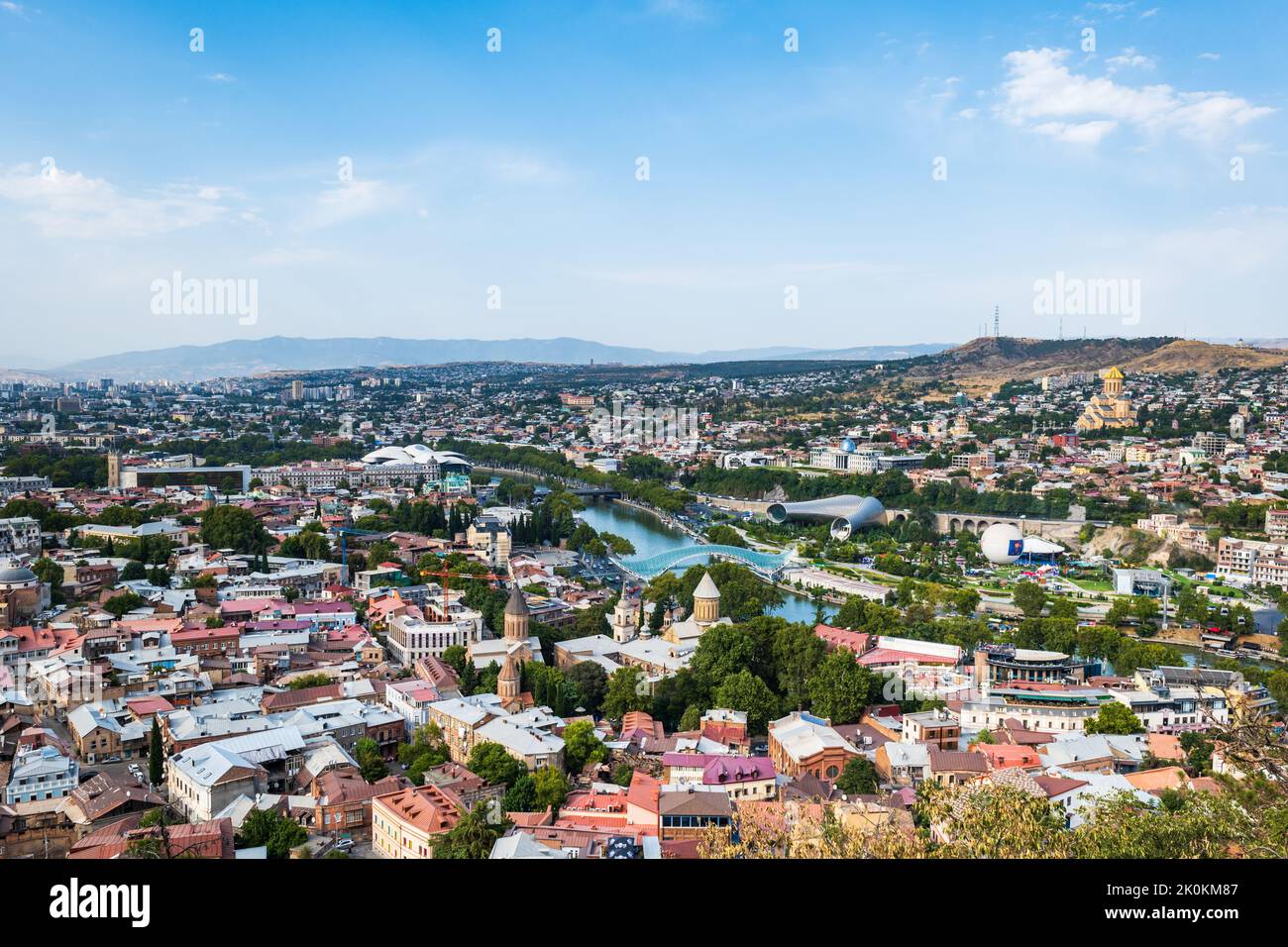 Tbilisi cityscape in summer, Georgia. Top view over the city center and Kura river in Tbilisi. Aerial view of the Georgian capital Stock Photo