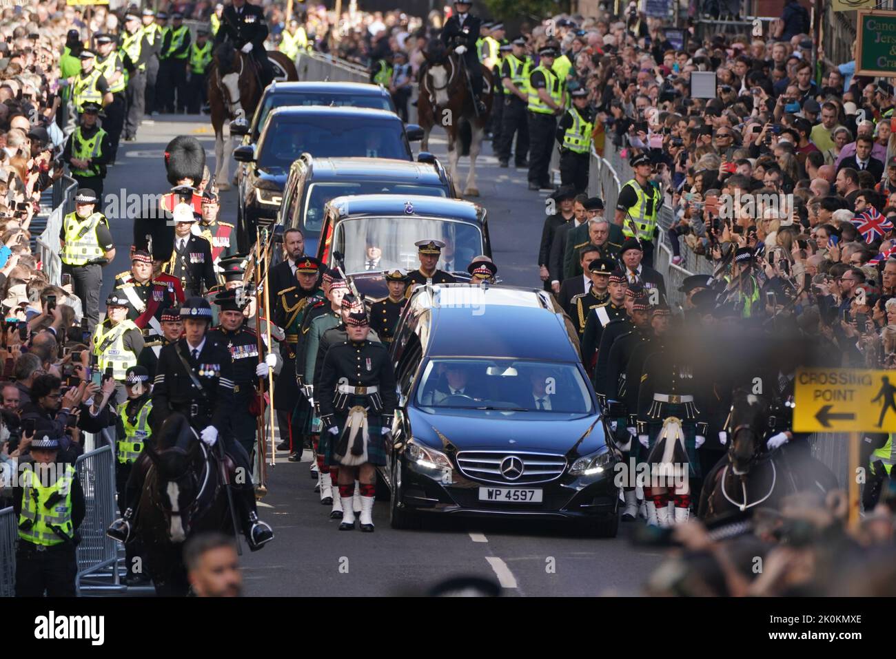 King Charles III and members of the royal family join the procession of