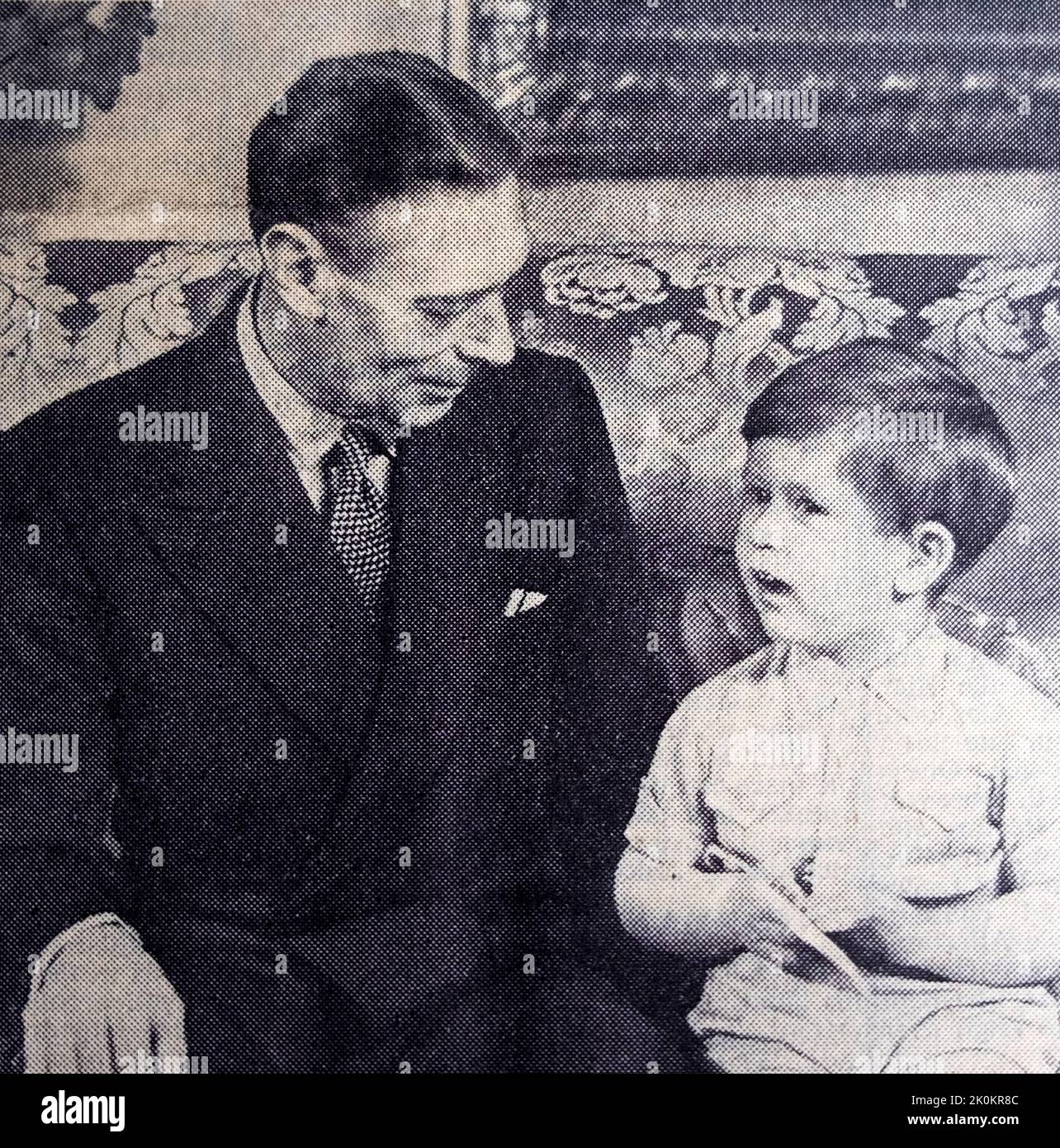 King George VI talking to Prince Charles child boy age 3 (now King Charles III) portrait 1951 in The Times newspaper London England UK Stock Photo