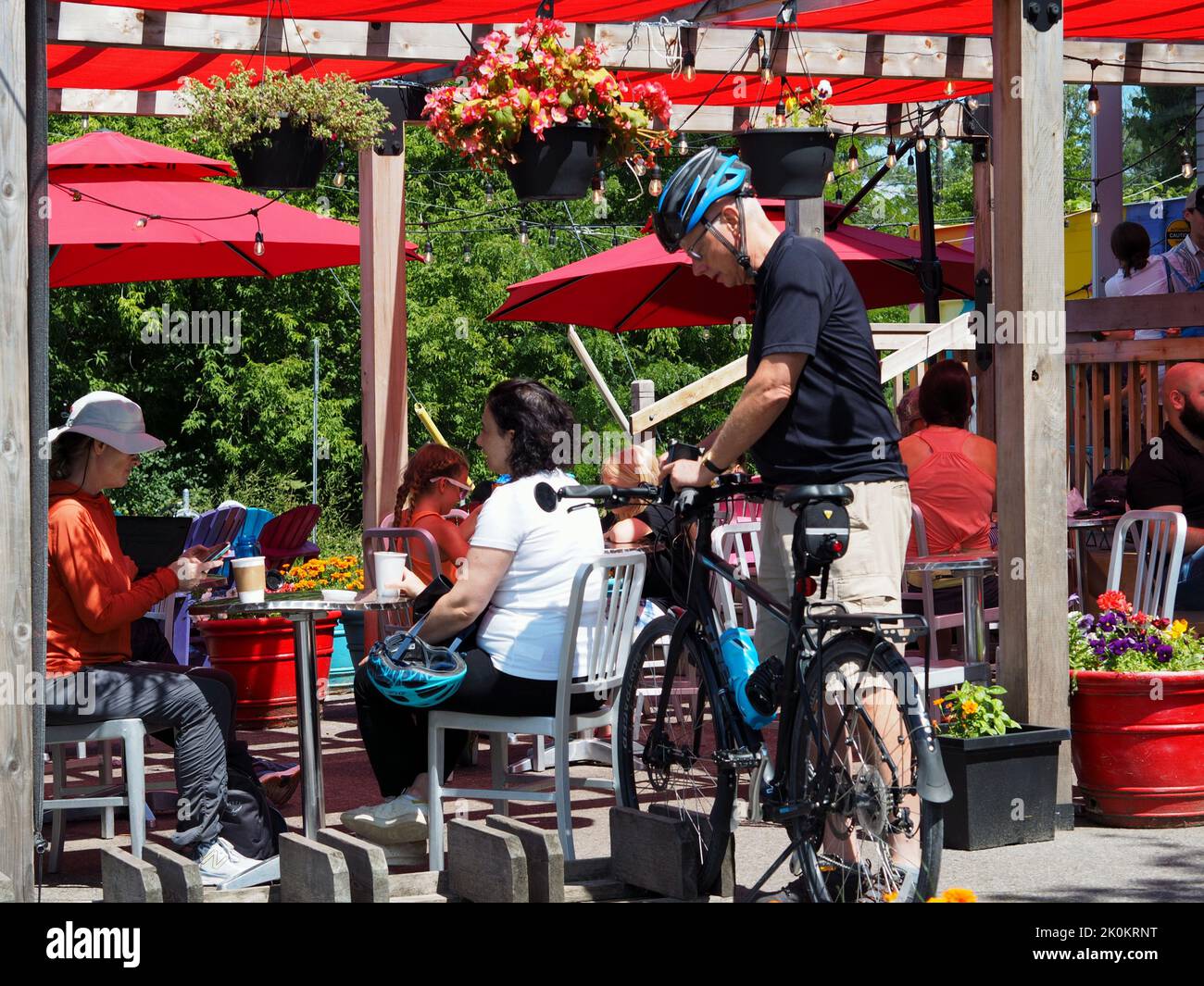Cafe patrons enjoying the summer sunshine on the patio of the Beach Coners in Ottawa, Ontario, Canada. Stock Photo