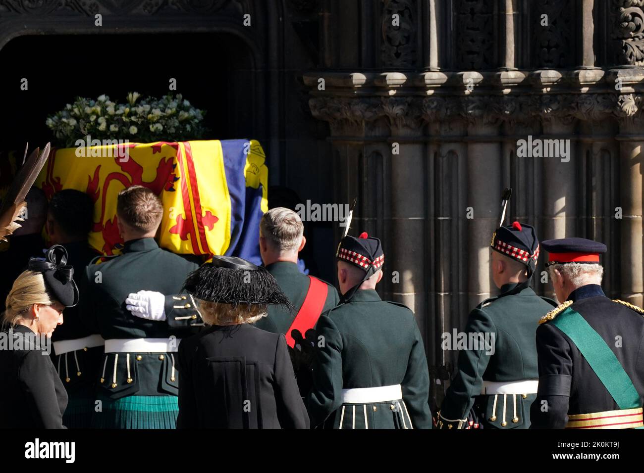 King Charles III joins the procession of Queen Elizabeth II coffin from
