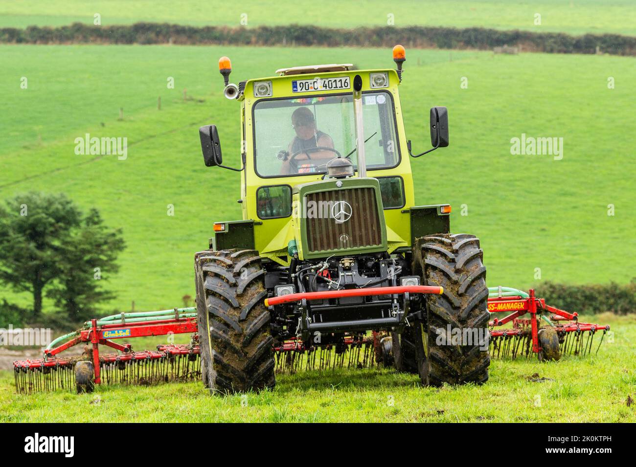 Timoleague, West Cork, Ireland. 12th Sep, 2022. A big exponent of sustainable farming, West Cork based dairy farmer David Deasy prepares the ground for stitching clover on his farm in Timoleague. David is using an Einbock Grass Harrow being hauled by a fully restored 1990 Mercedes MB Trac 1100 tractor. Credit: AG News/Alamy Live News Stock Photo
