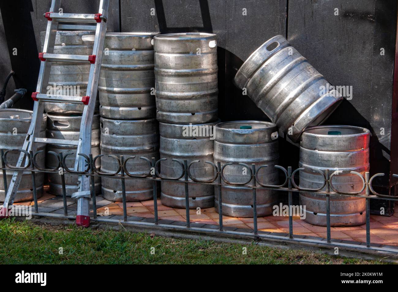 Stack of beer Kegs waiting in a bar. Beer stainless steel barrels