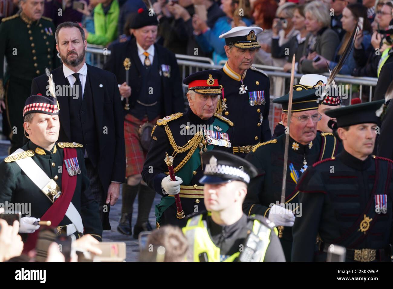King Charles III walks behind Queen Elizabeth II's coffin during the procession from the Palace of Holyroodhouse to St Giles' Cathedral, Edinburgh. Picture date: Monday September 12, 2022. Stock Photo