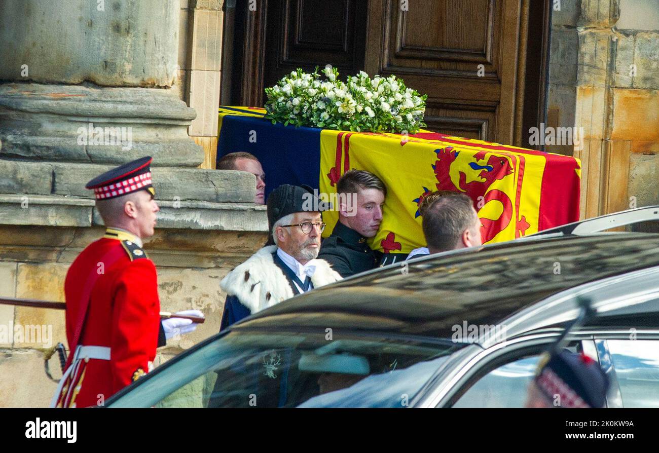 Royal guards carry Queen Elizabeth II's coffin at the start of the